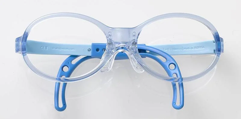 Tomato Glasses – Stylish, Durable, Kid Approved 1 A pair of blue and clear glassesDescription automatically generated